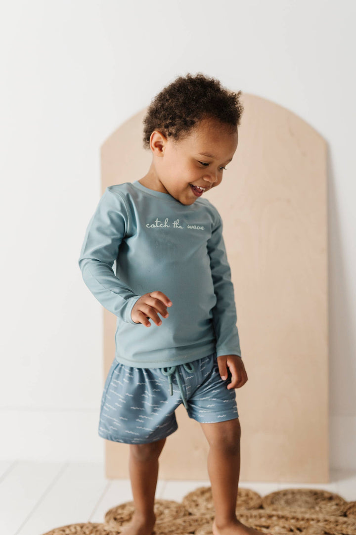 Boy's Swim Shorts in Waves